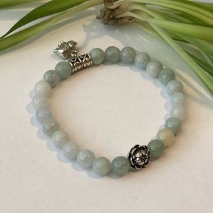 Jade bracelet with silver lotus flower charms